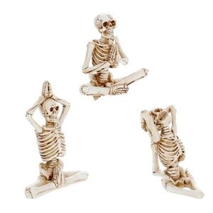 skeletal figurines positioned in various yoga poses.